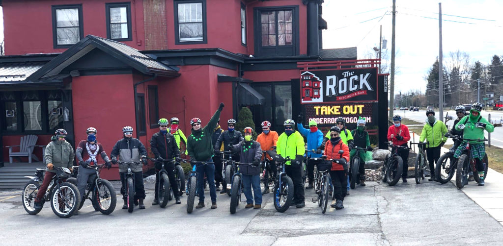 Riders of Peanut Roll X gather outside The Rock Kitchen and Bar.